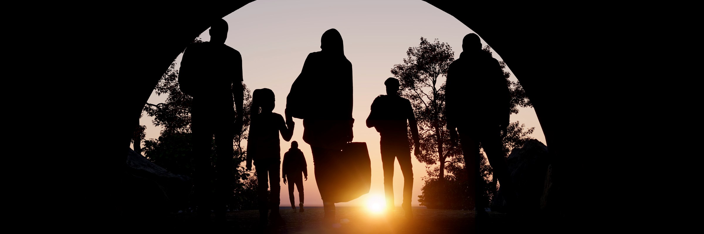 Column of migrants passing through a tunnel.