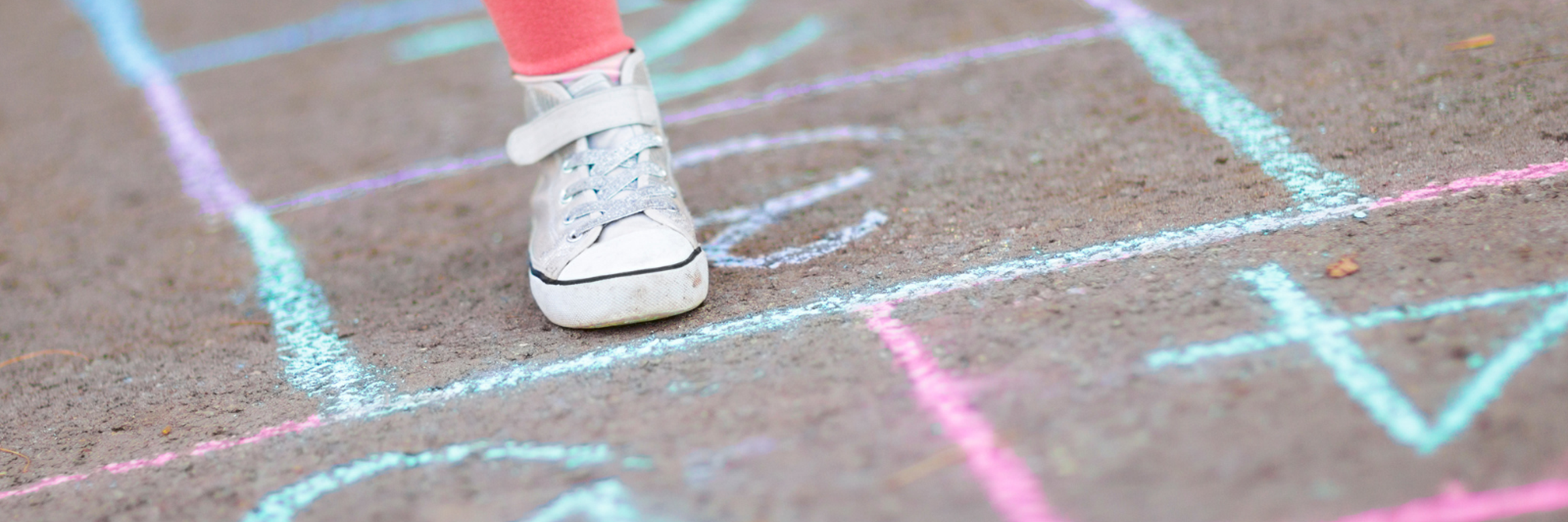 girls feet playing hopscotch