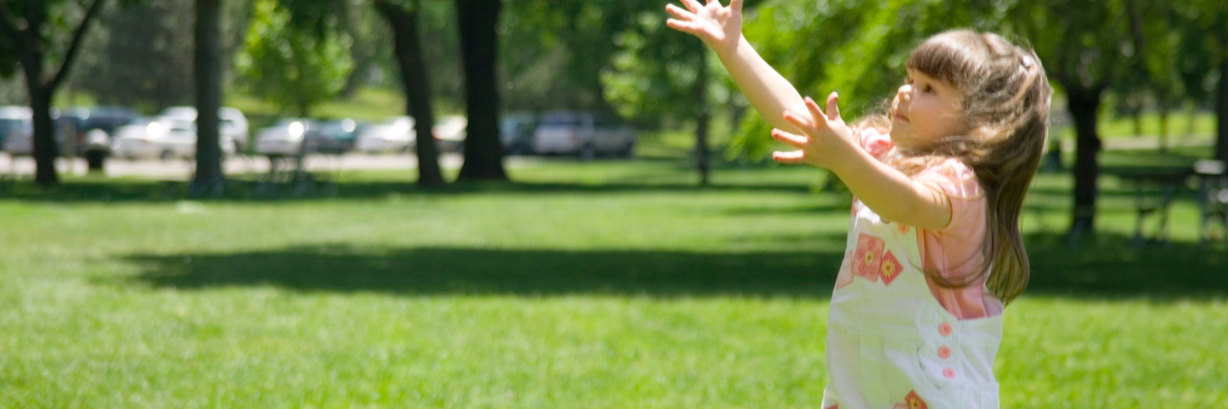 Child playing with balloon