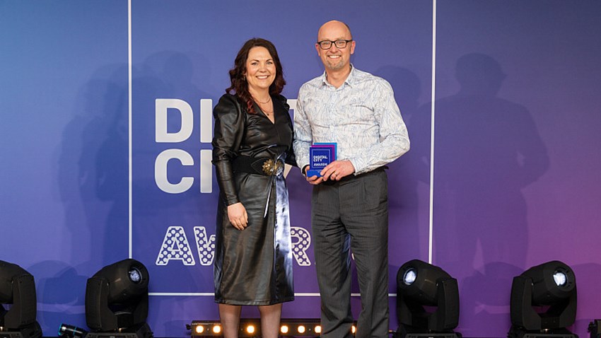 An image of Phil Swan receiving an award