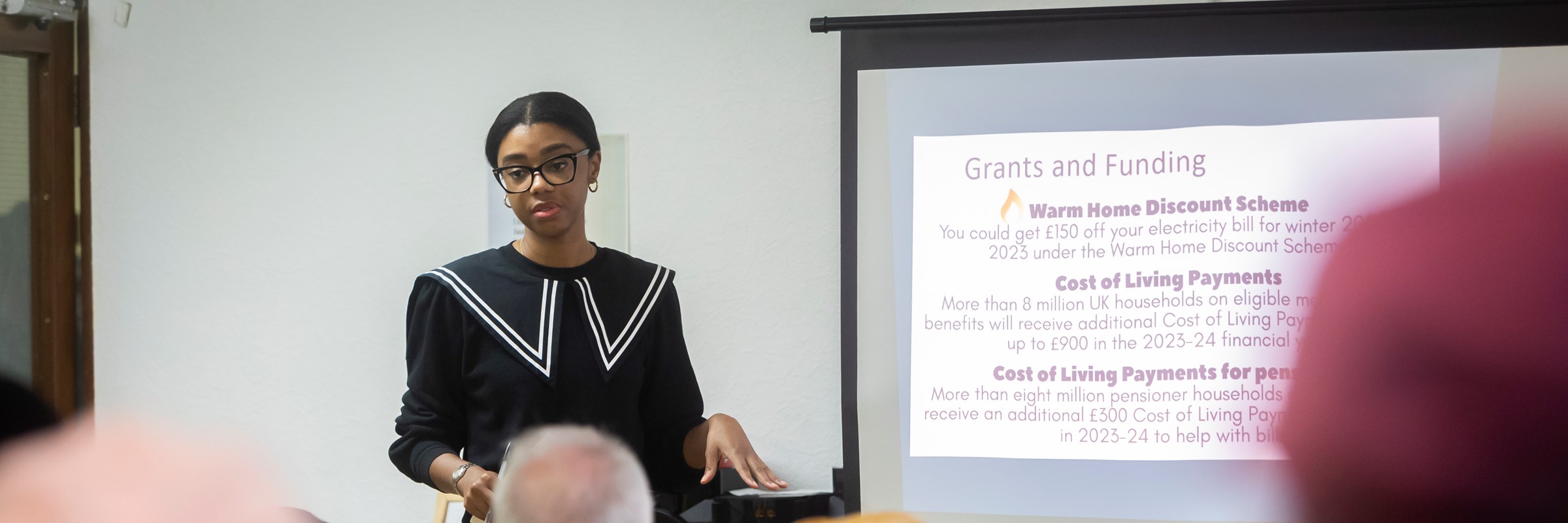 A woman teaching a class of people