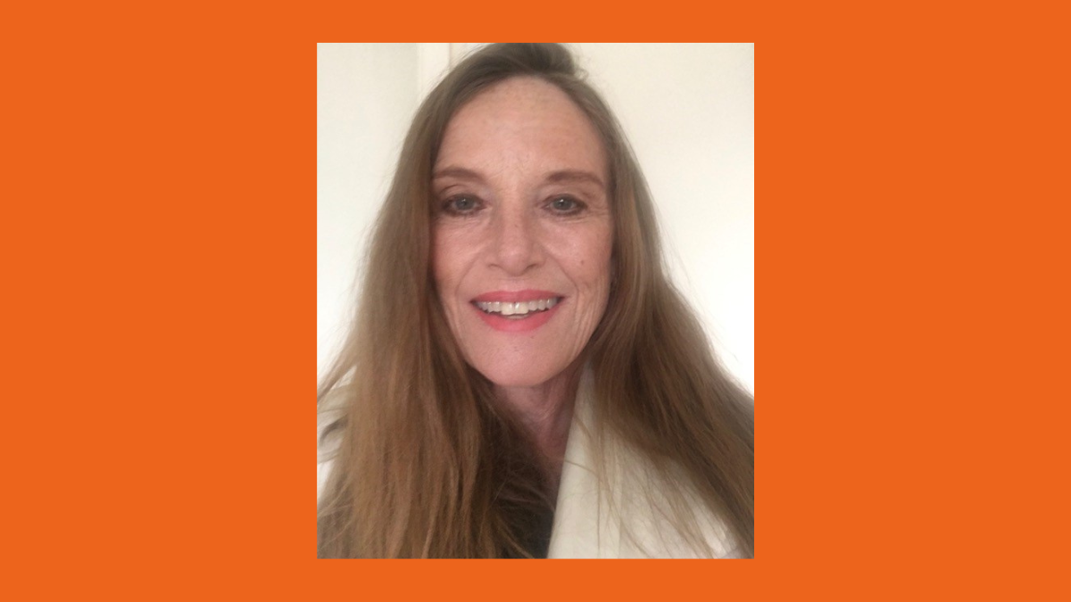 Photo of Elaine Brady on an orange background