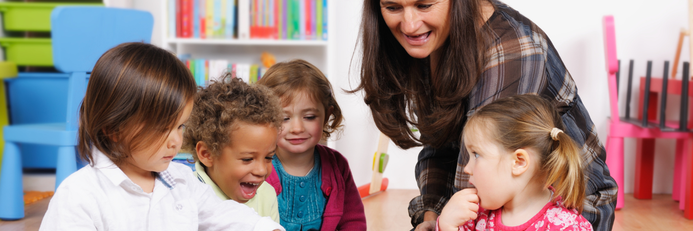 teacher sharing book with children
