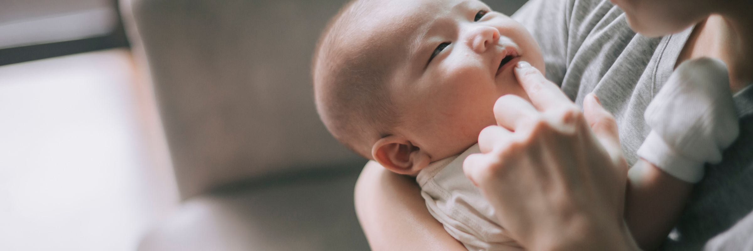 baby looking up at parent
