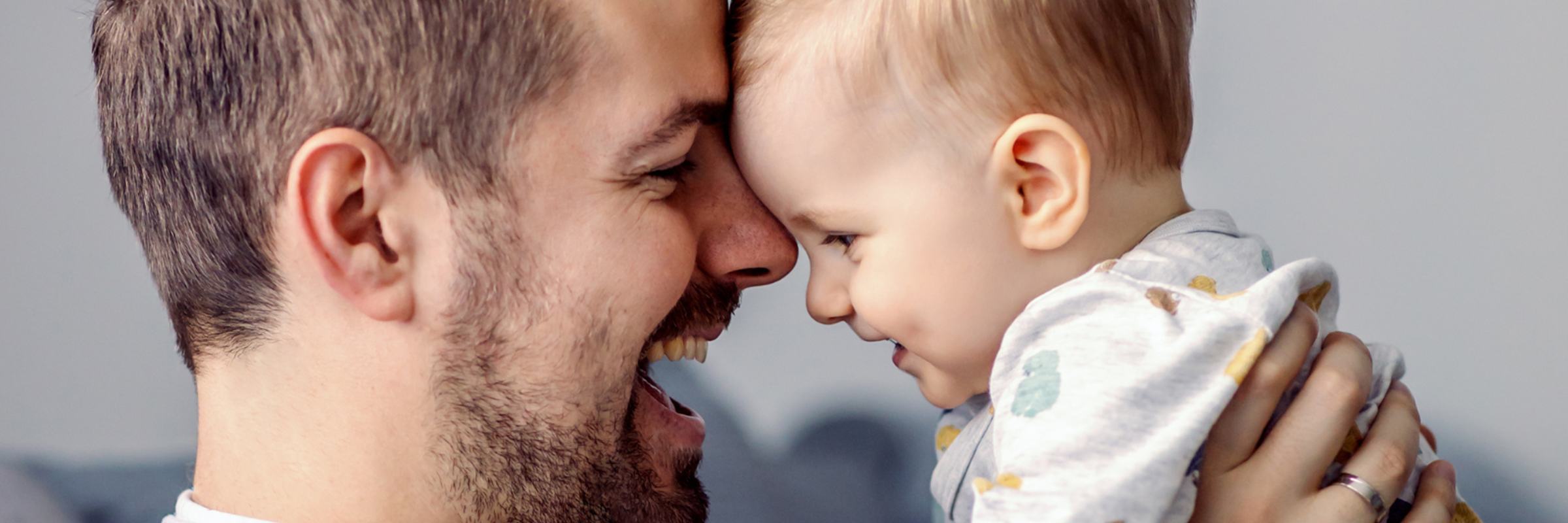 man playing with baby
