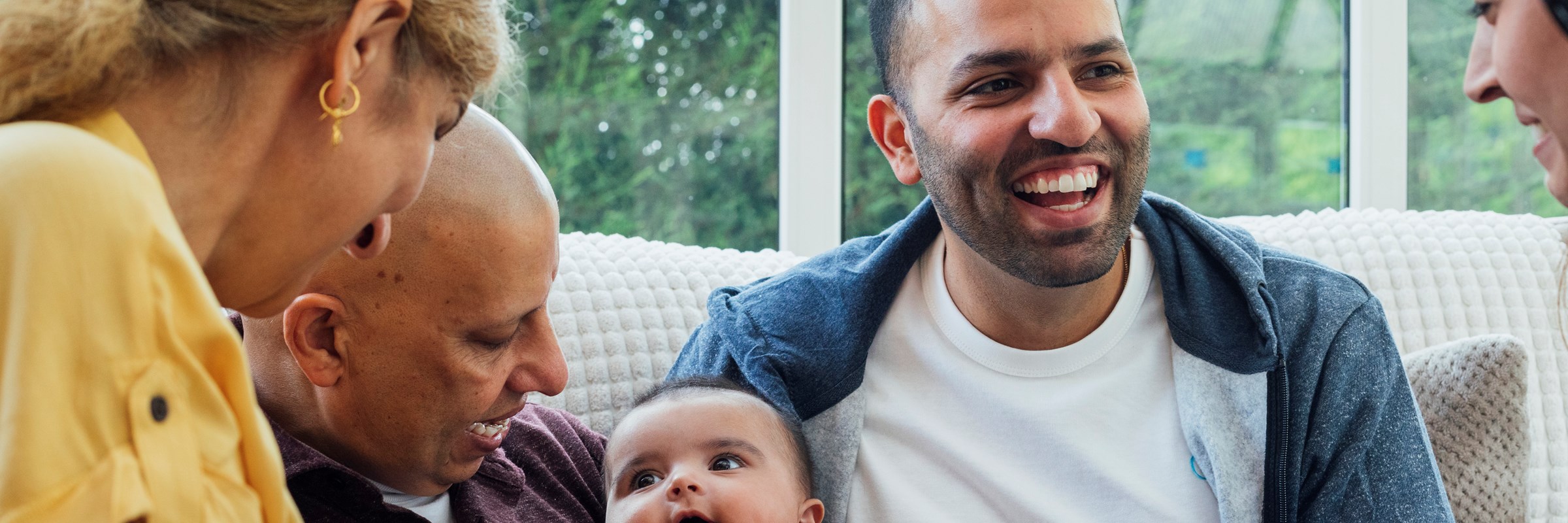 Family playing with baby