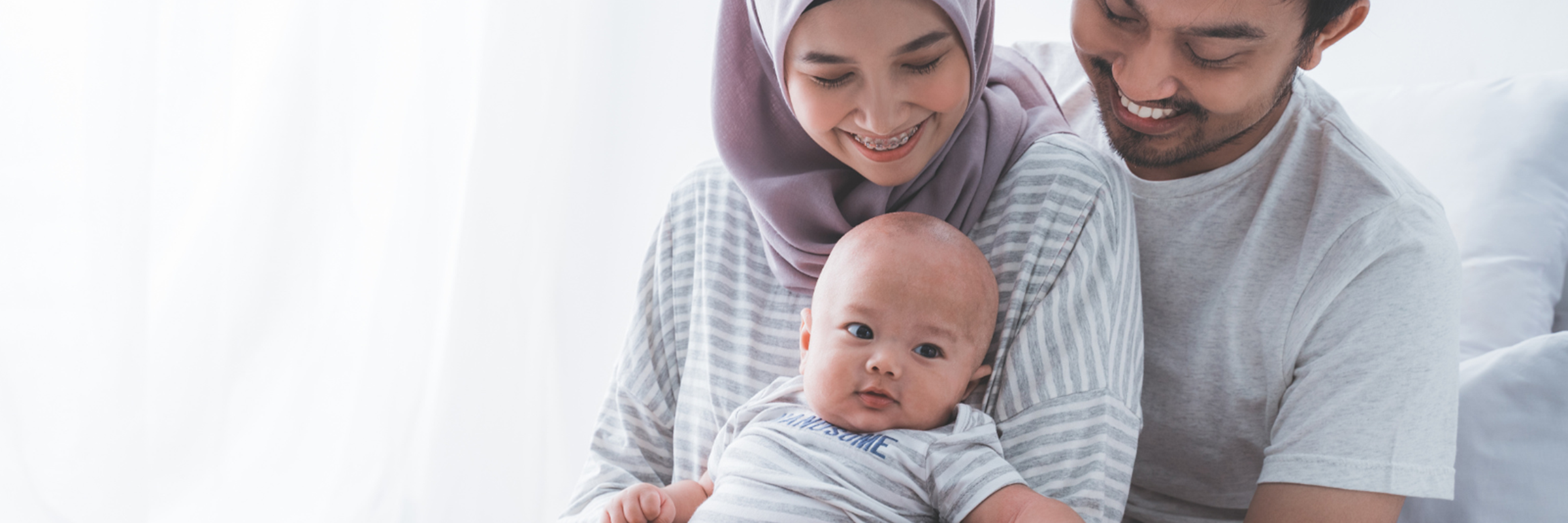 Family playing with baby