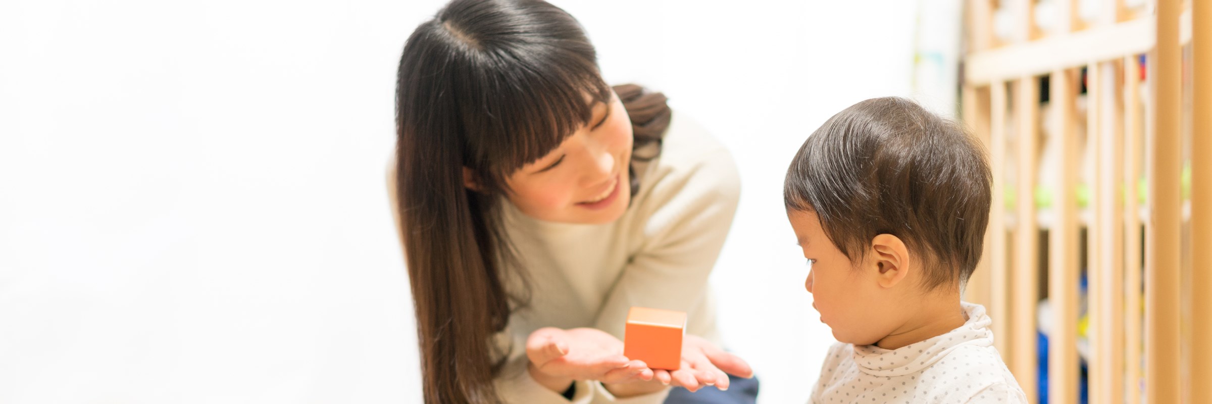 Mom and son looking at building blocks