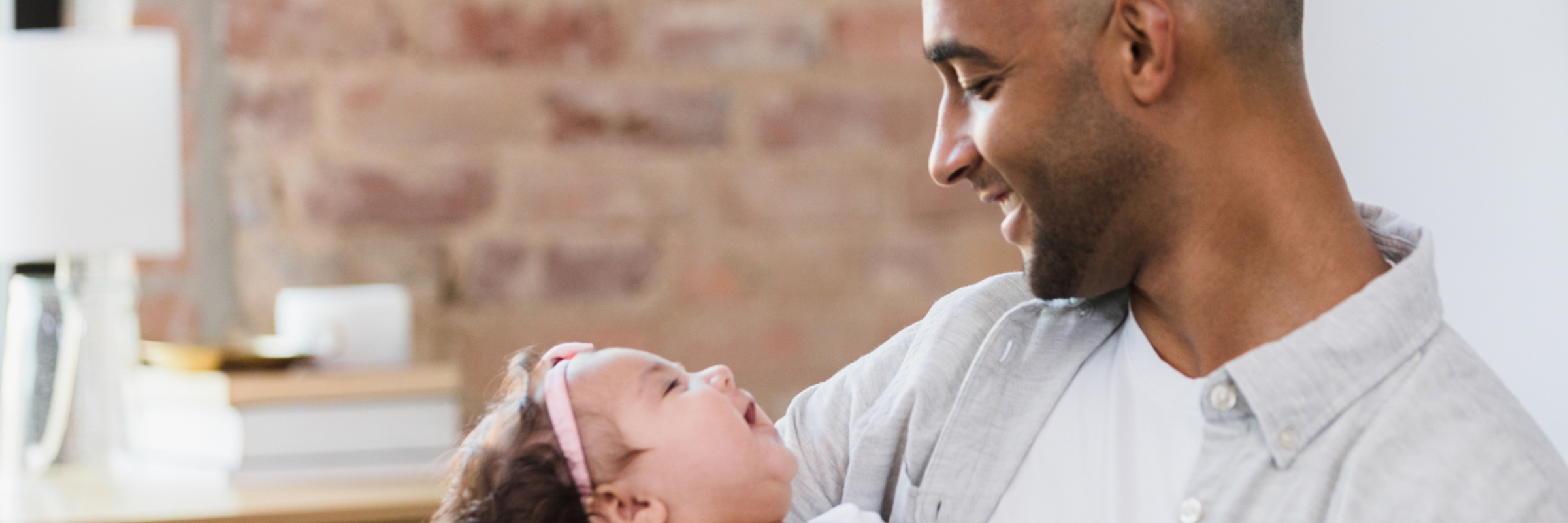 man playing with baby