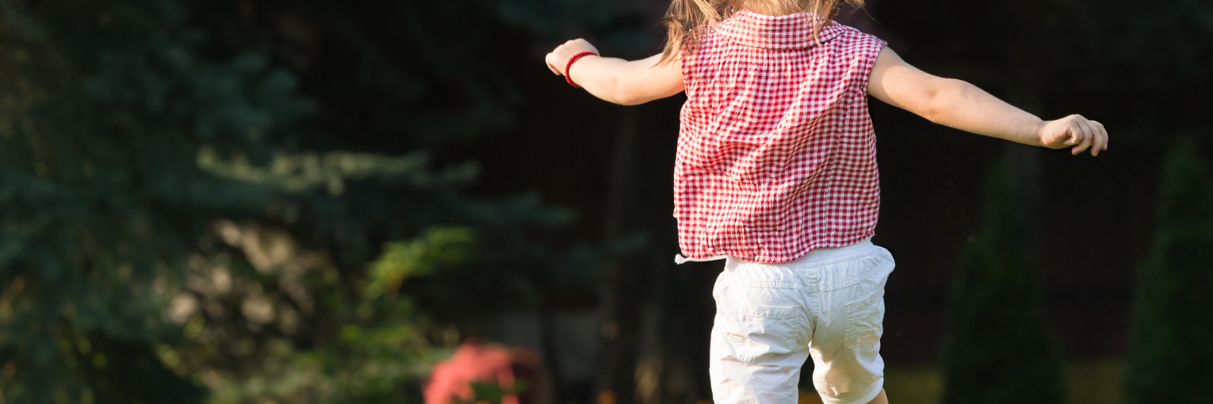 Child playing in field