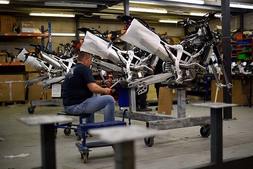 Staff member at CCM Motorcycles working on production of a new retail motorbike