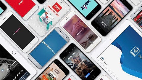 View from above of various smartphones and tablet devices laid out next to each other