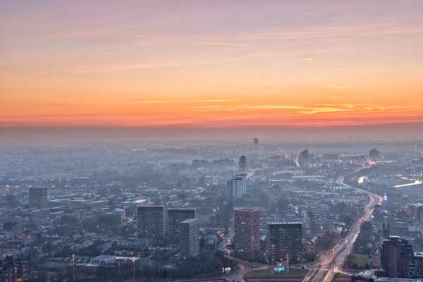 The sun setting over the Greater Manchester skyline