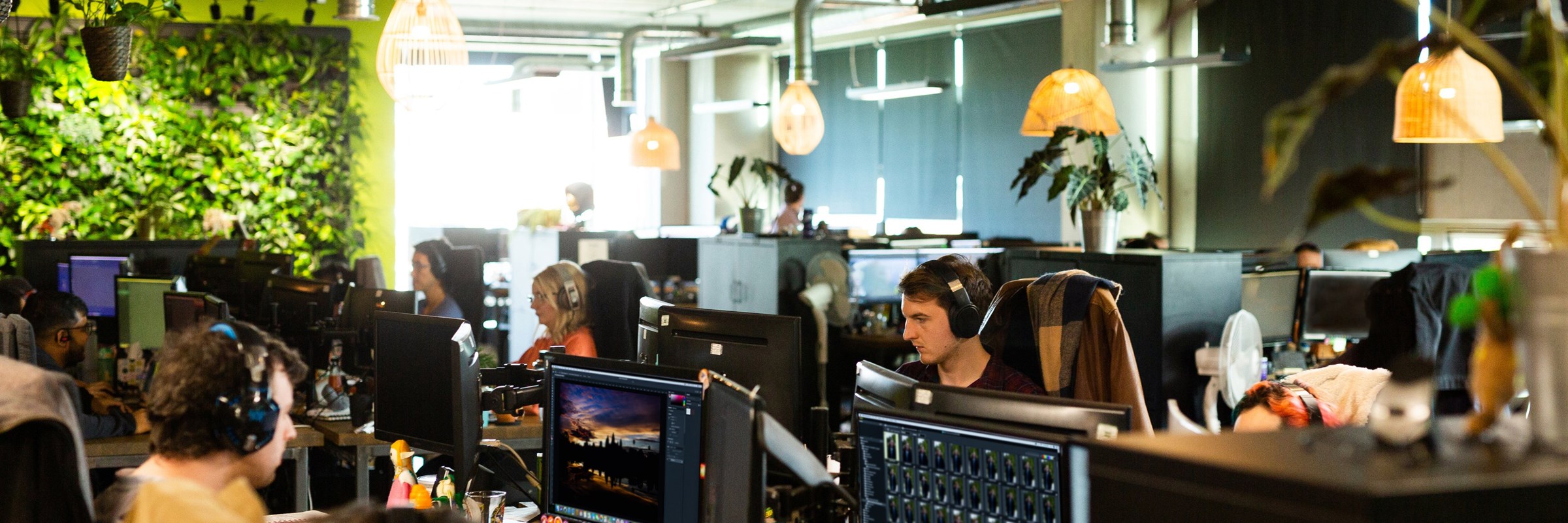 Open office floor with people working at computers