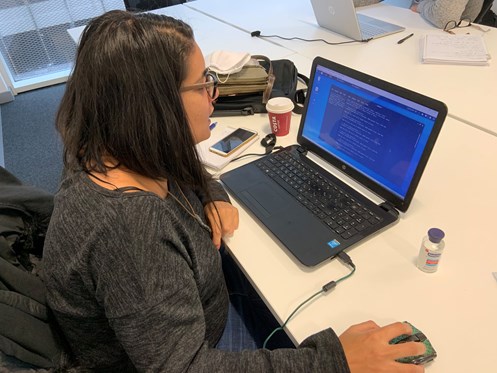 An image of a women working on her laptop