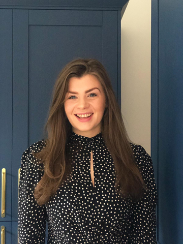 An image of Katie smiling to the camera