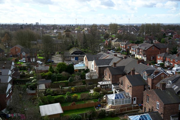 An aerial view of houses and gardens on a housing estate