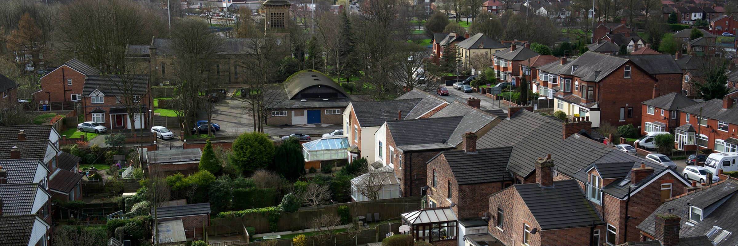 An aerial view of houses and gardens on a housing estate