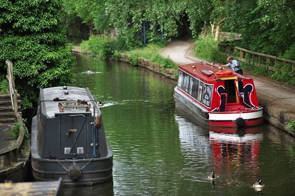 Two canal barges parked on a canal
