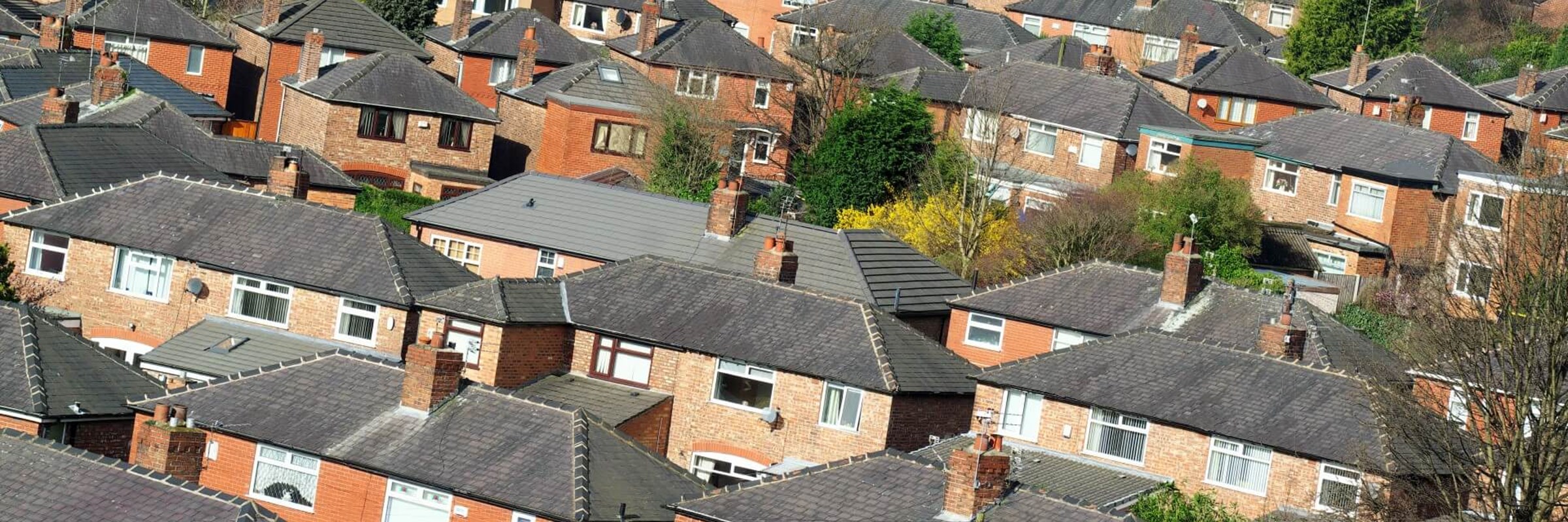 Photo of a Greater Manchester housing estate rooftops