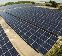 An aerial view of a large network of solar panels at the Bolton Solar Farm