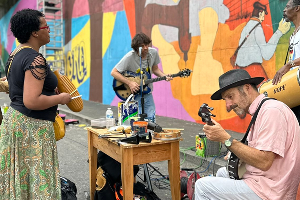 A group of people playing instruments outside