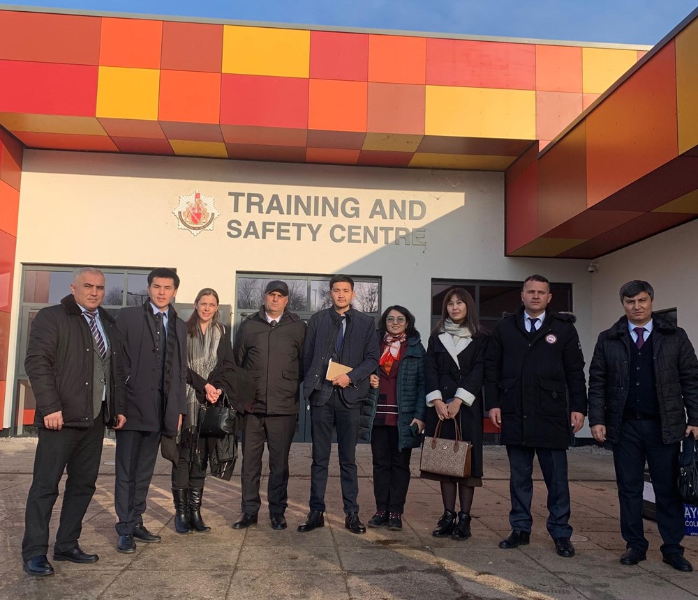 Nine people standing in front of Bury Training and Safety Centre.