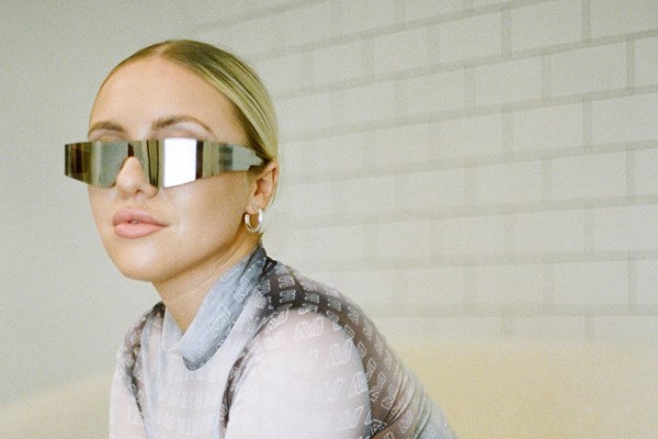 Image of Lois Rae in gold reflective sunglasses 