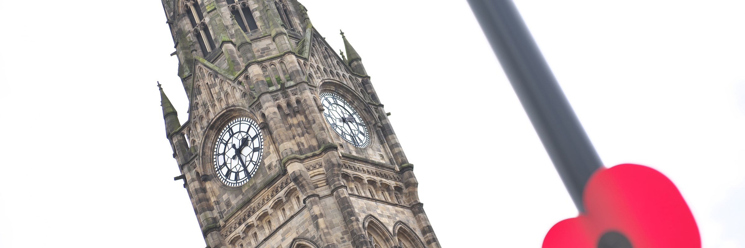 Rochdale Town Hall with a poppy
