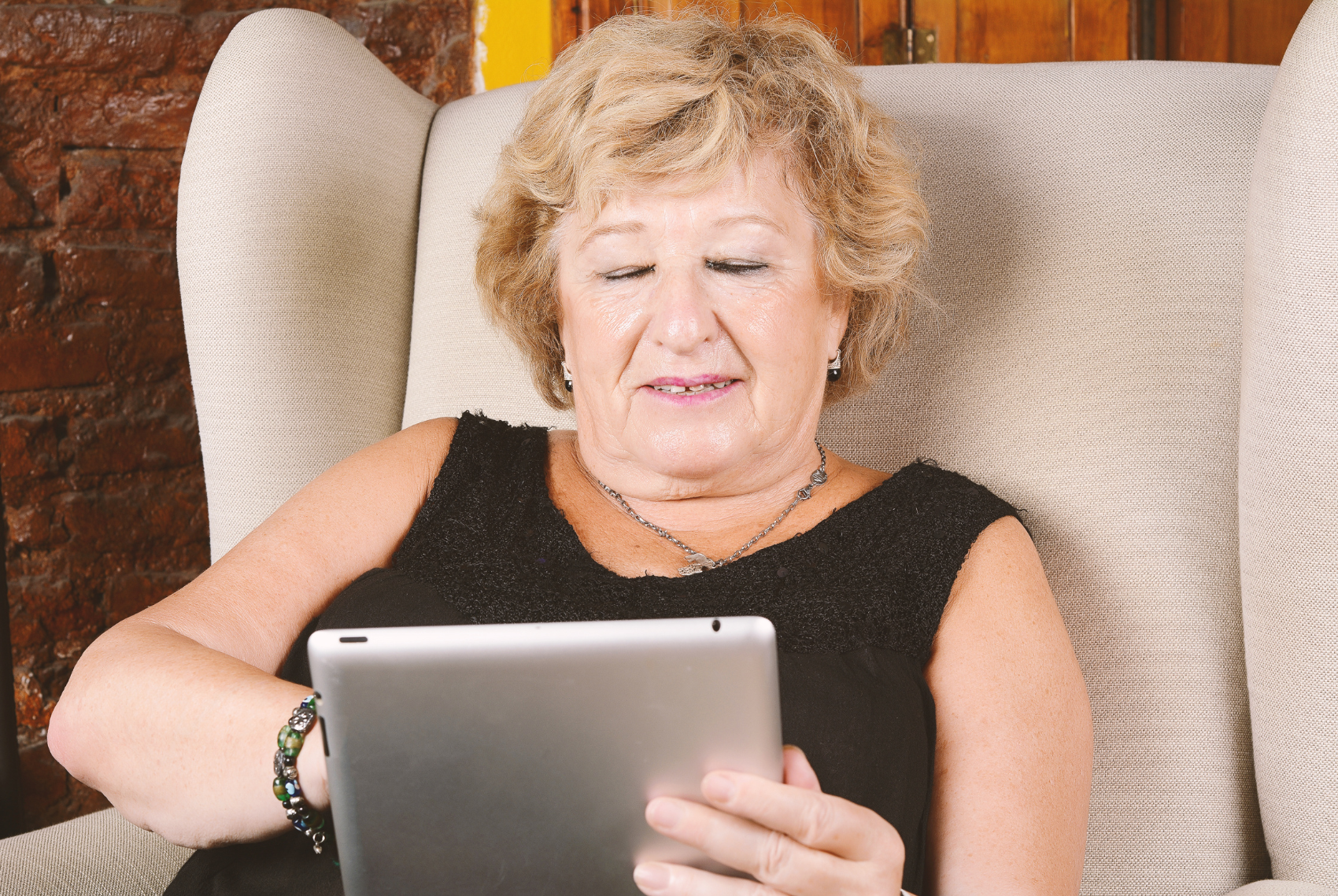 Older person using a tablet device