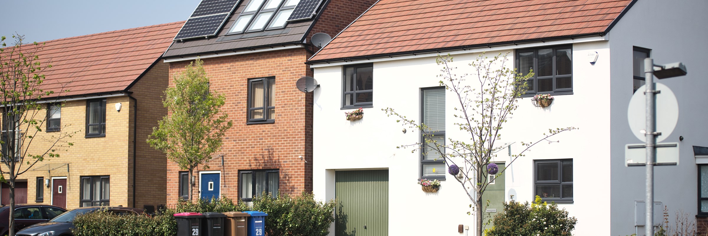 A front-on image of three new houses in Greater Manchester