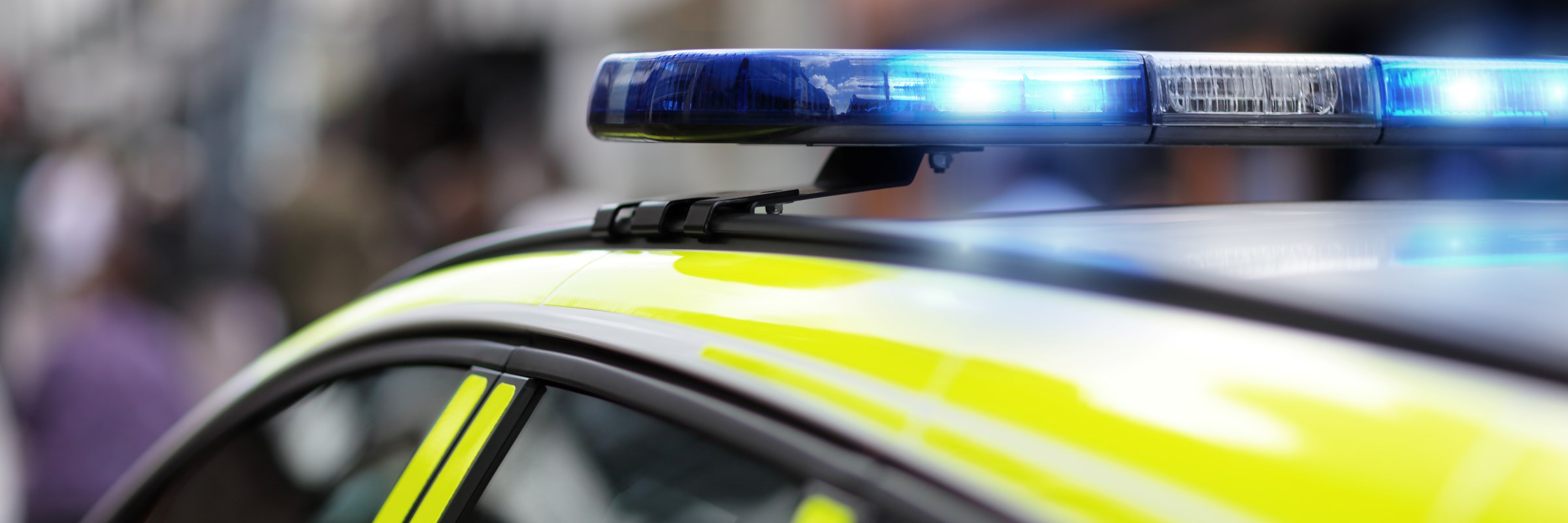 Police siren flashing blue lights at accident or crime scene