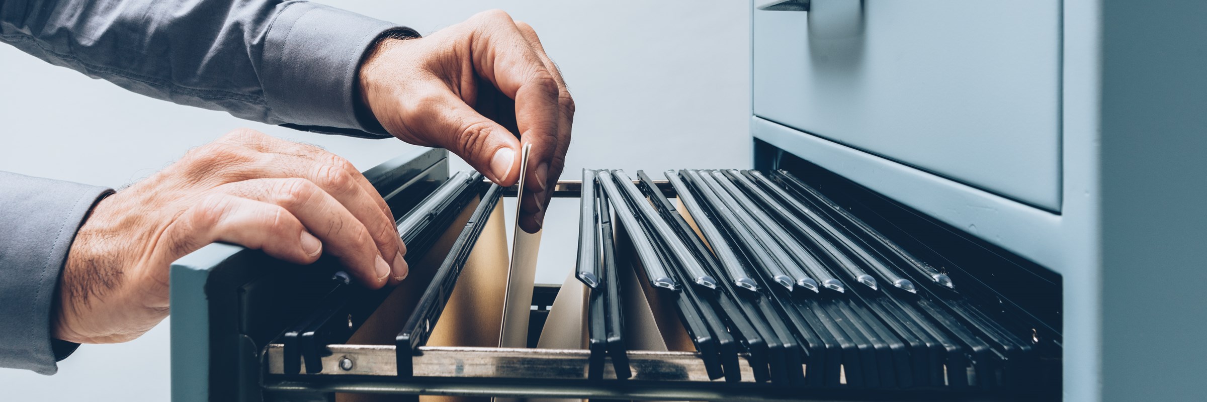 Office clerk searching for files