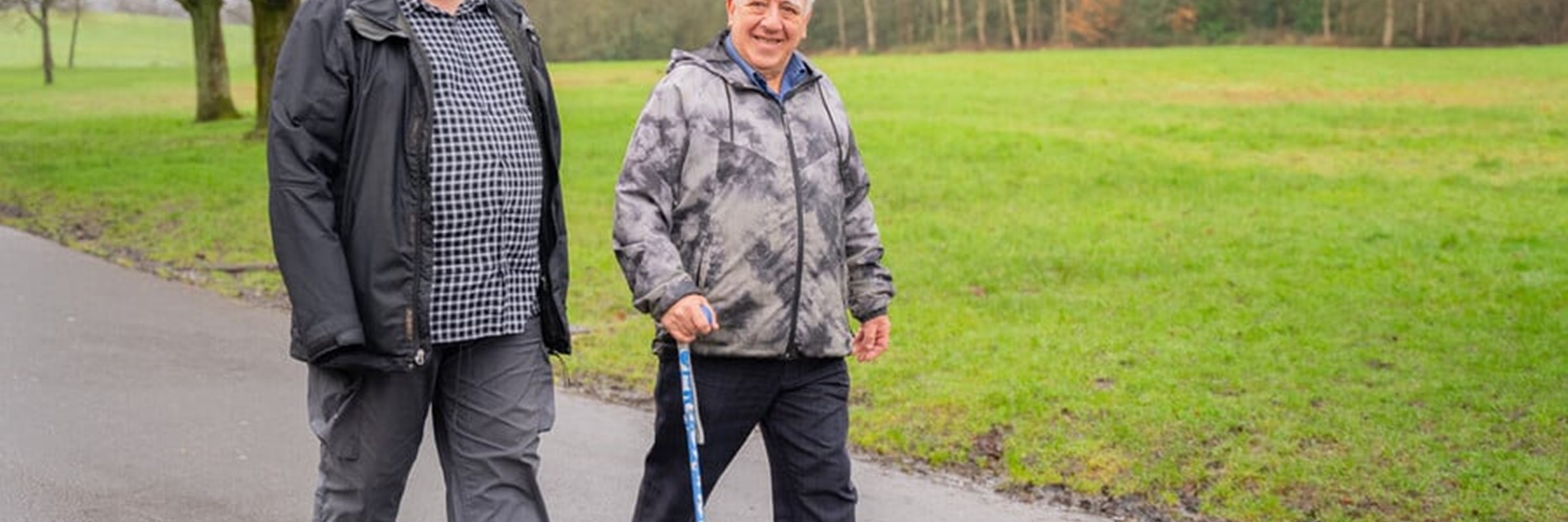 Two men walking outside